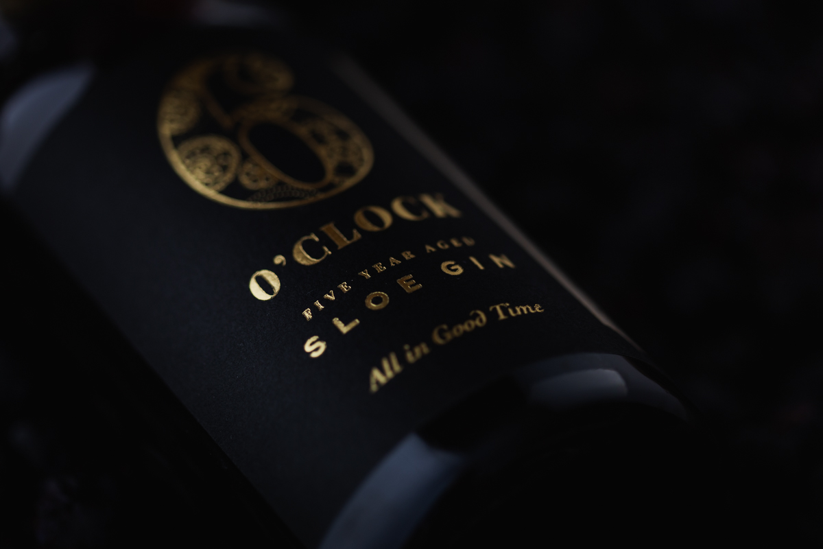 Bottle of sloe gin with a dark background