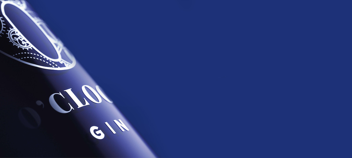 A picture a 6 o'clock gin bottle at an angle